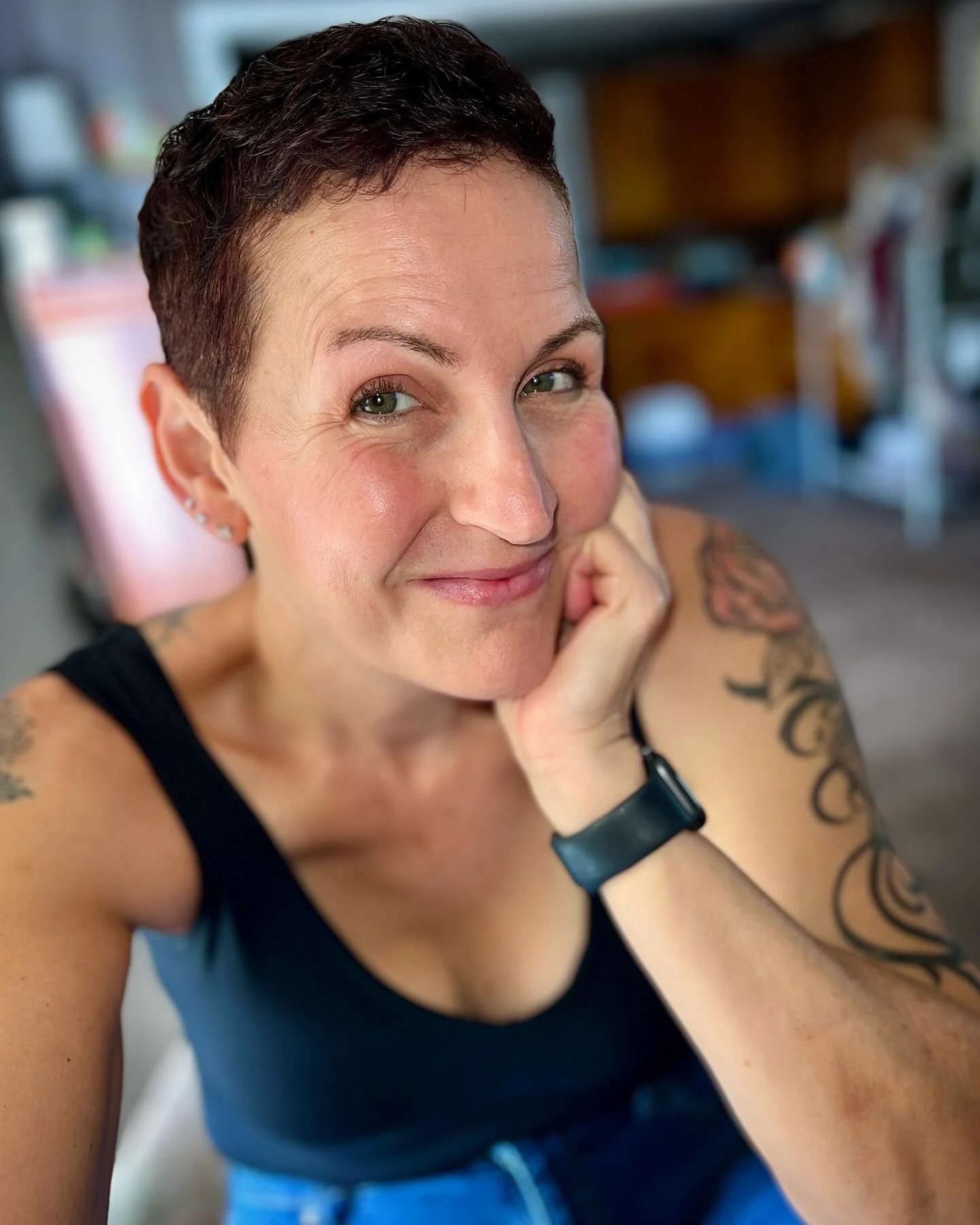 Short curly pixie embracing natural curl pattern