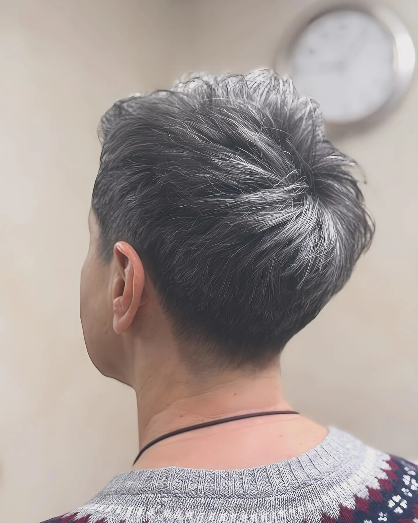 V shaped pixie back view showing lifted crown and tapered nape